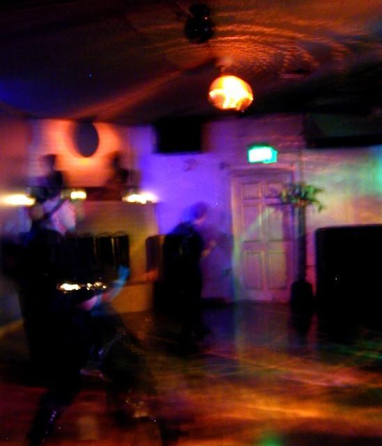 swriling lights and dancers