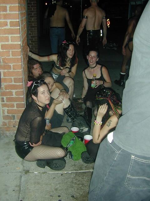 squatting on the sidewalk