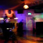 swriling lights and dancers