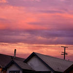 Colorful Clouds atop Roofs